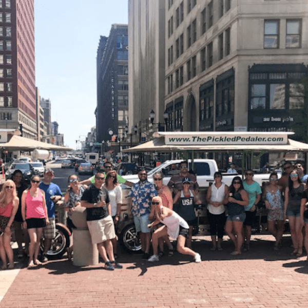 a group of people walking on a city street
